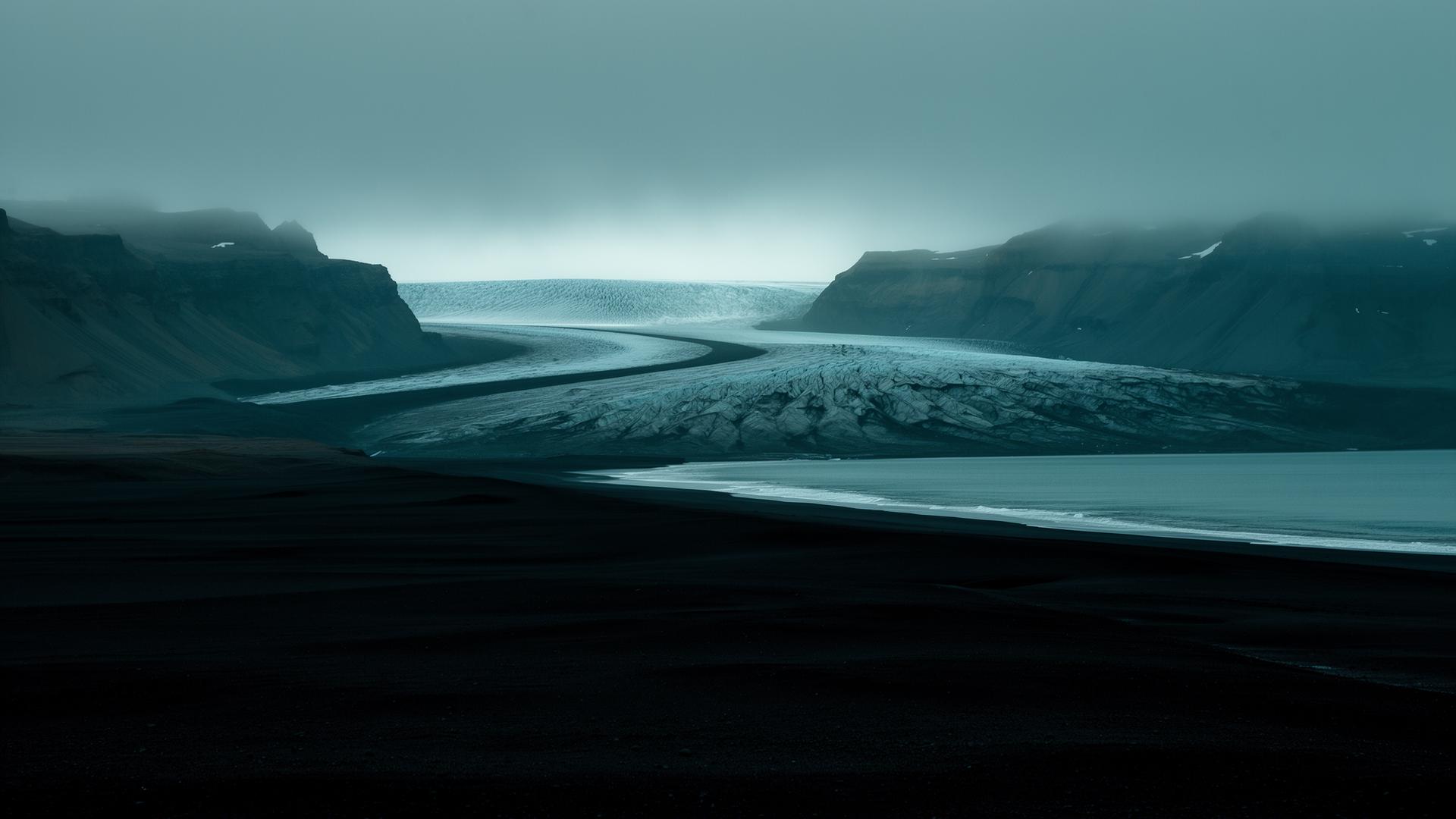 Glacier flowing into a black sand coastline in Iceland